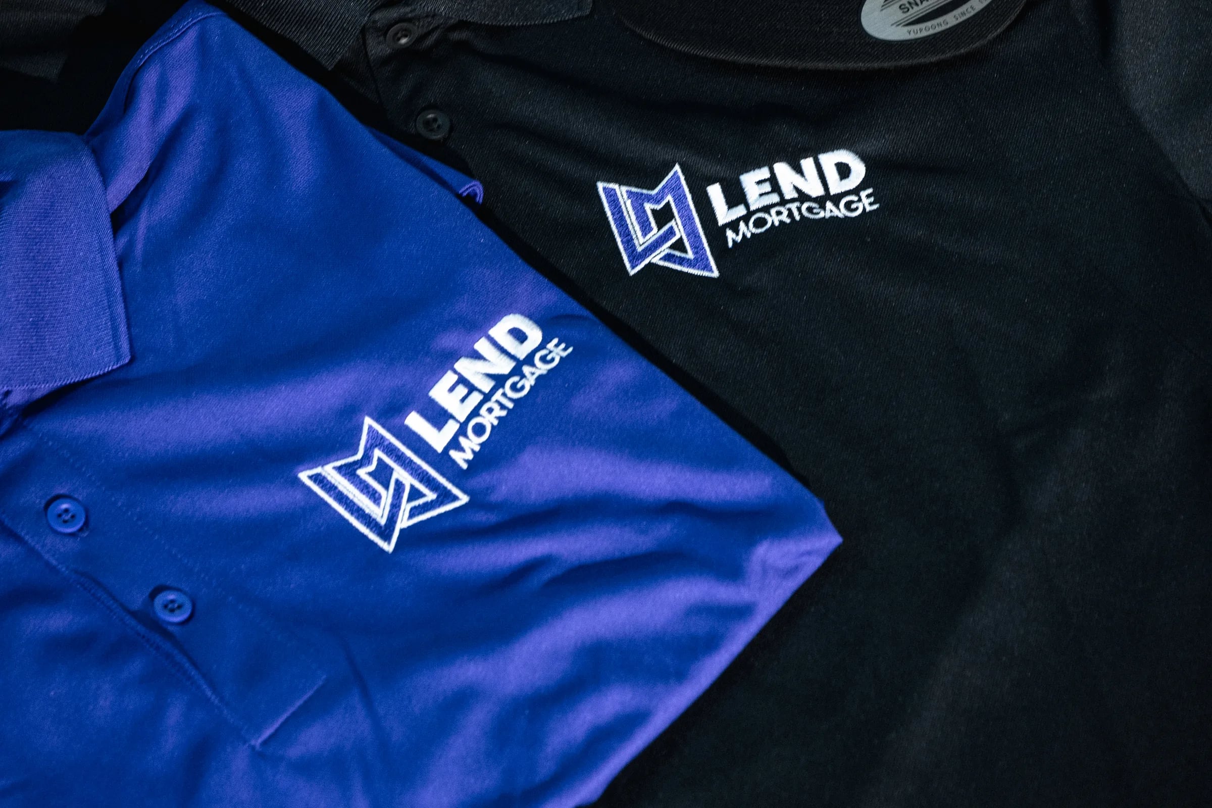 Embroidered Polos & Work Uniforms — Left-chest logos and stitched names on polos, button-downs, and uniform shirts. Professional from the first wear.