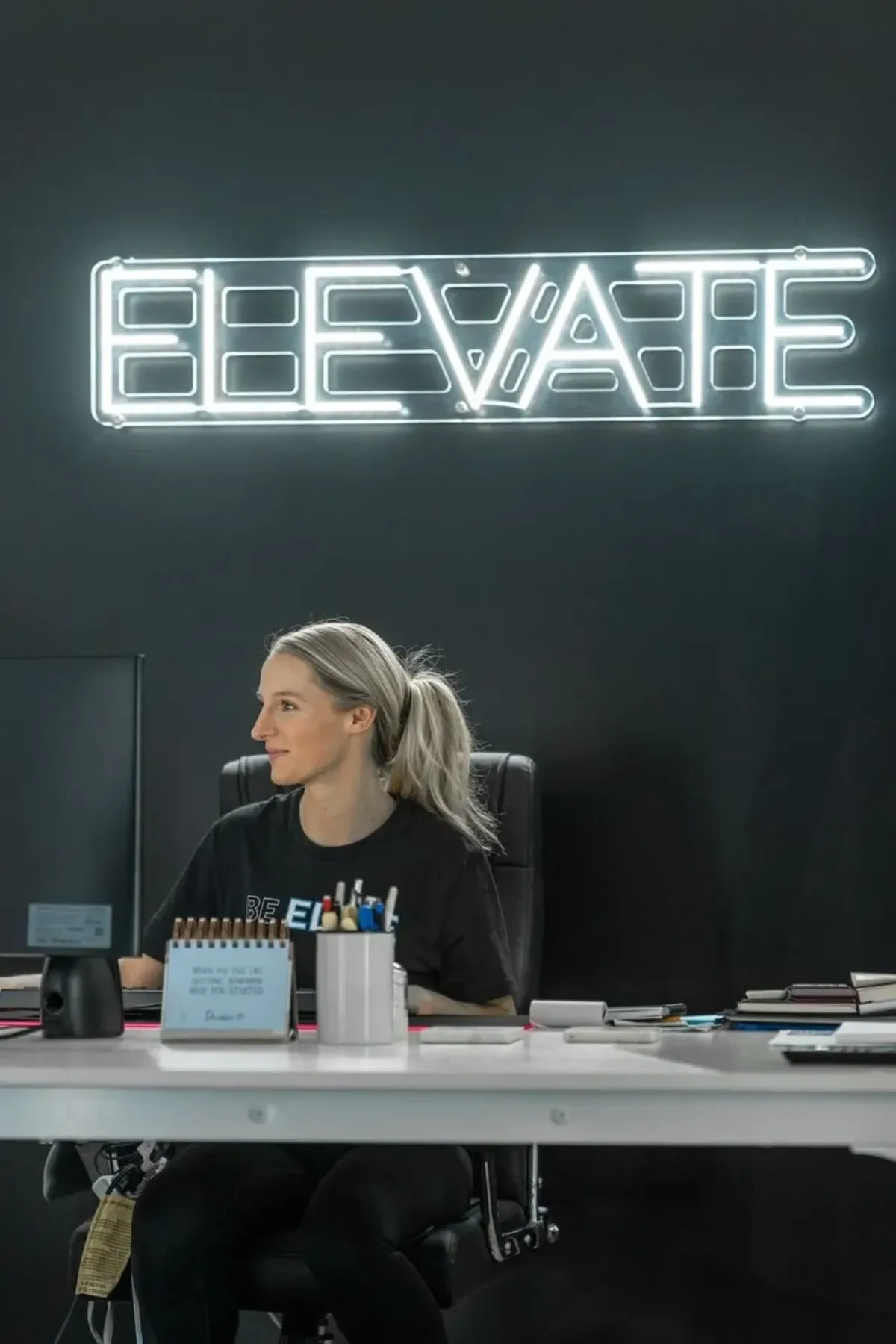 Founder Carleigh Meade at her desk at Elite Custom Apparel in Sayreville, NJ